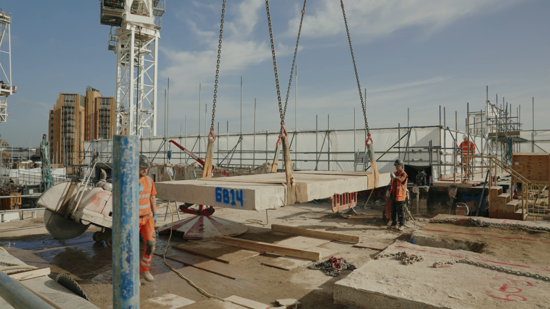 A photo showing a concrete slab being lifted from the site